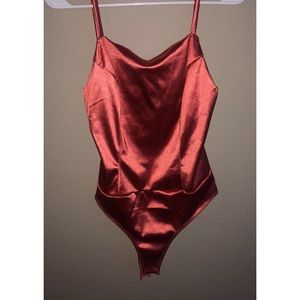 Orange IRIS bodysuit. Size Medium.